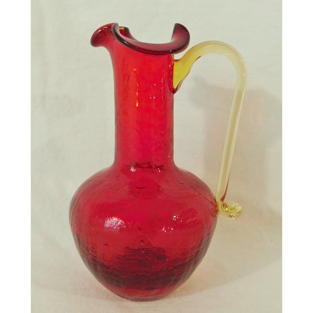 Sweet vintage mid century Blenko hand blown red crackle glass with applied yellow handle syrup pitcher or vase. Pontil on...