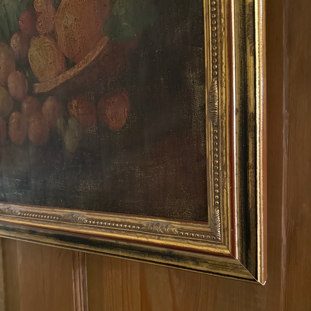 Antique oil on canvas hand, painted depicting various fruits, including a pineapple and a copper jug and a wooden bowl in...