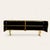A brass cabinet, inspired by the moon, enchants with its chiseled surface, rich in craters and curves evoking the lunar...