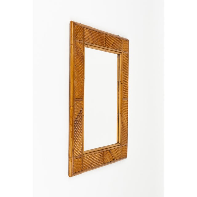 Midcentury beautiful rectangular wall mirror in bamboo and rattan attributed to Vivai del Sud. Made in Italy in the 1970s....