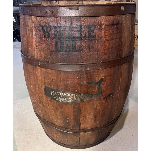 An early American treasure. This 19th century oak barrel has been repurposed as a table. Has a heavy, smoked glass top...