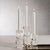 Illuminate your space with style and grace. Our crystal glass taper candle holder with a square column shape and sleek...
