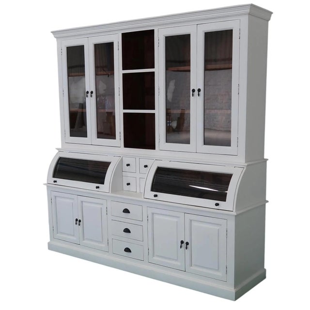 This Modern Farmhouse kitchen pantry is a large cupboard crafted from solid wood with a white buffet server, featuring a...