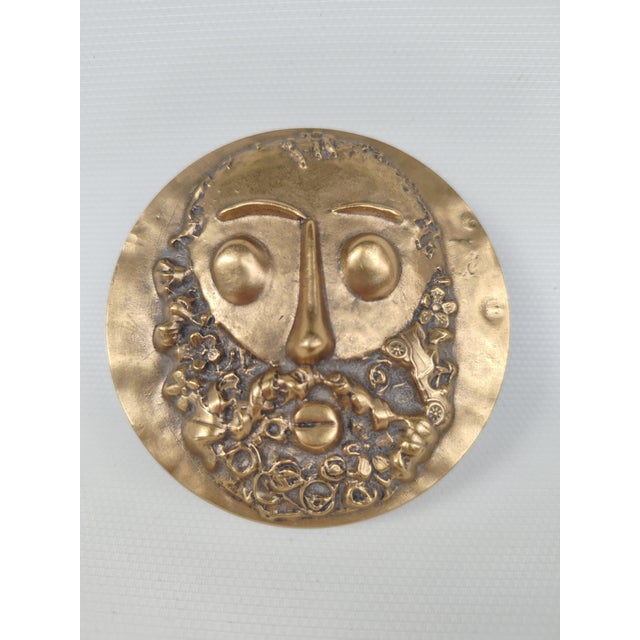A double-sided gilt bronze medal entitled "Homage to César," created by the artist and engraver Roger Bezombes (1913-1994)...