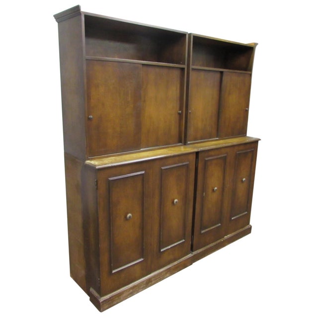 Pair of Traditional style solid wood cabinets with original pulls and hardware. There are display compartments above the...