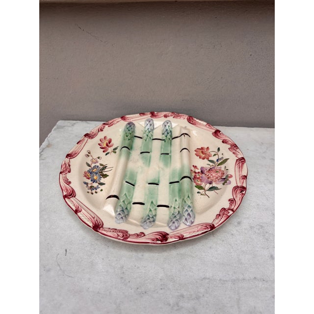 Majolica asparagus plate with flowers , signed Longchamp circa 1890.