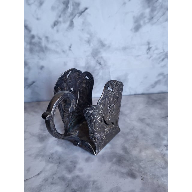 This item originally held a square glass inkwell insert. Made of heavy dark pewter with detailed embossed floral and...