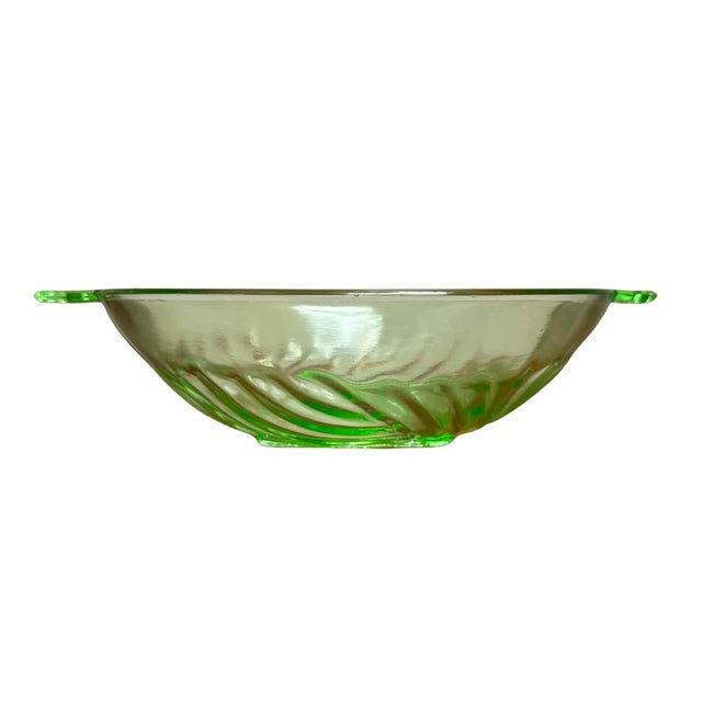 A beautiful set of five vintage Art Deco uranium glass dessert bowls comprising one large serving bowl and four matching...