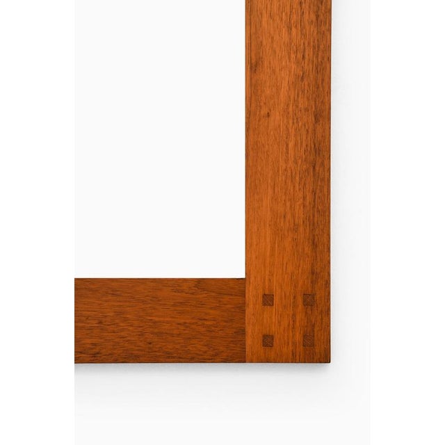 This rare mirror, designed by uno & östen kristiansson and produced by luxus in vittsjö, sweden, during the 1950s, is a...