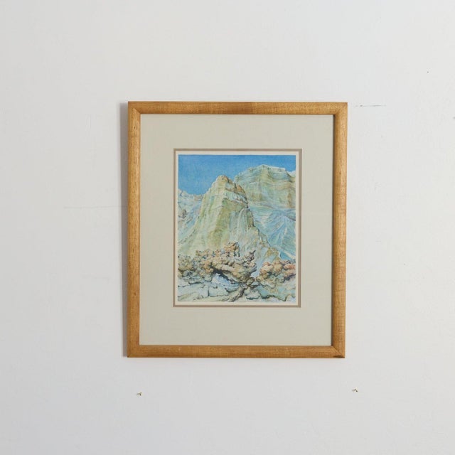Original 1983 watercolor by Edward Cronquist of jagged green and blue rock spires rising above a weathered stone...
