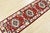 A tribal Caucasian Kazak runner hand-knotted with an all-wool pile on a cotton foundation. This oriental rug features...