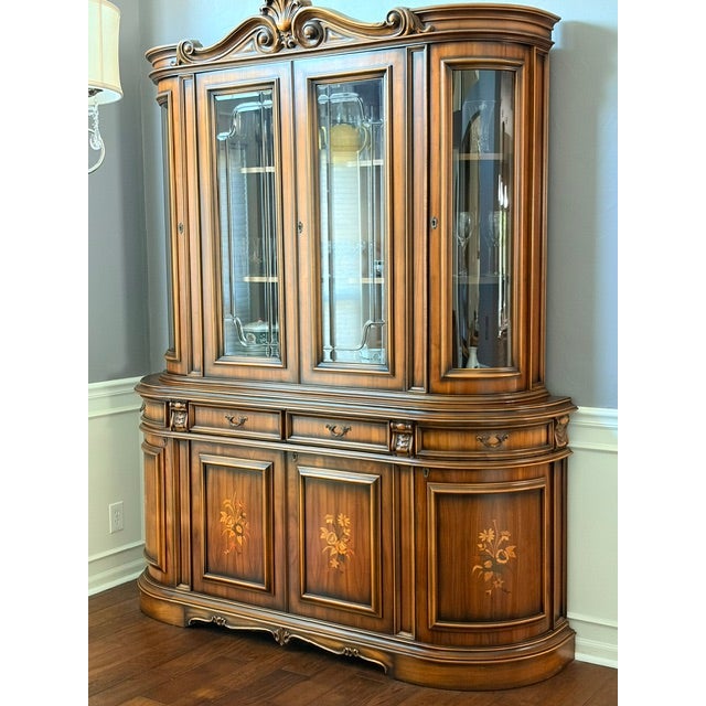 This magnificent two-part Italian Provincial Baroque-style china cabinet is a true statement piece. Crafted with a rich...