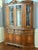 This magnificent two-part Italian Provincial Baroque-style china cabinet is a true statement piece. Crafted with a rich...