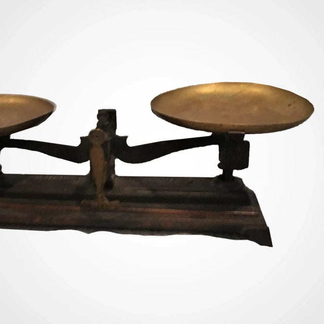 Authentic iron and brass 19th century grocery food scale with wear & tear from aging.