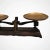 Authentic iron and brass 19th century grocery food scale with wear & tear from aging.