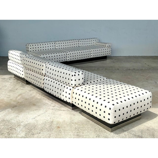 This vintage custom geometric sectional sofa is a striking embodiment of mid-century modern design, blending bold visual...