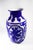Milk white glass Peking vase with carved royal blue overlay. Design consists of four framed views of flora and birds. A...