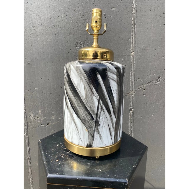 We turned these striking porcelain vases into lamps, right here in our brock and mortar shop. Brand new and one of a kind.