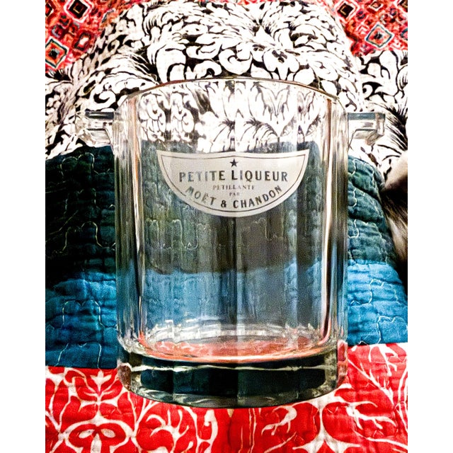 This is a vintage Moët & Chandon Petite Liquorelle ice bucket. The bucket has a heavy, faceted glass or crystal design. It...