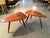 A near pair of sculpted tripod triangular tables in American Walnut studio crafted by Phil Powell in his New Hope Studio....