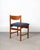 English dining chairs by White and Newton. The frame is constructed of solid teak, and the backrest features a subtle...