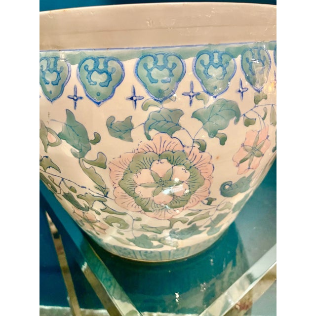 Art Deco style porcelain fish bowl with pink and blue floral motif. This piece would make an excellent planter or side...