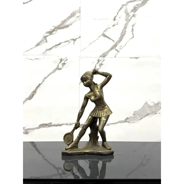 bronze statue, depicting a young tennis player, this is the 1950s, Art Deco style. The item despite its age is in...