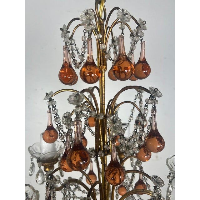 Five light Italian crystal beaded chandelier. The chandelier has a tiered design with multiple levels of decoration and...