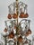 Five light Italian crystal beaded chandelier. The chandelier has a tiered design with multiple levels of decoration and...