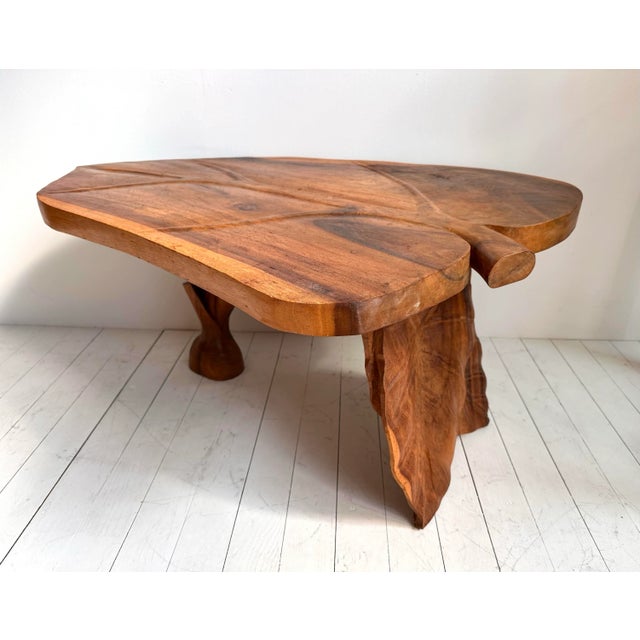 This Mid Century Acadia wood coffee table was made in South East Asia around the 1950's or 1960's. Handcarved from a...