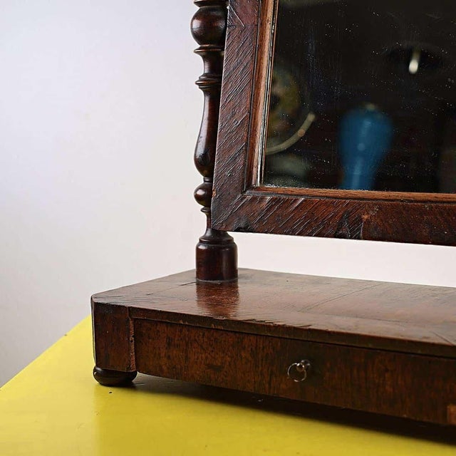 Antique wooden table mirror Height: 46.5 Width: 40 Depth: 18.2 This piece is attributed to the mentioned designer/maker....