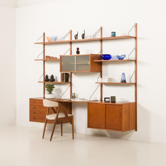 This elegant danish mid-century teak wall unit, designed by preben sorensen and manufactured by ps system in randers in...