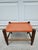 This little footstool has plenty of character with the orange woven rope top, tapered legs and thin stretchers. This piece...