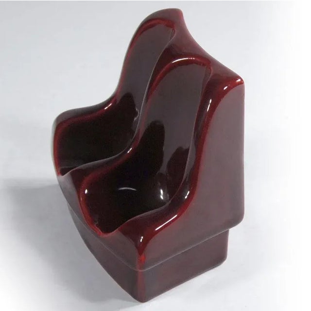 A decorative base made of glazed ceramics. It comes from the Italian SC3 label from the 1970s. Signed. Two pipes can be...