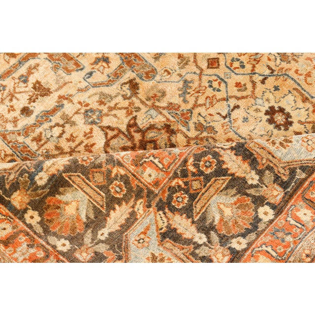 An early 20th century Persian Tabriz rug, the caramel field with an unusually-angular split-leaf, floral vinery and...