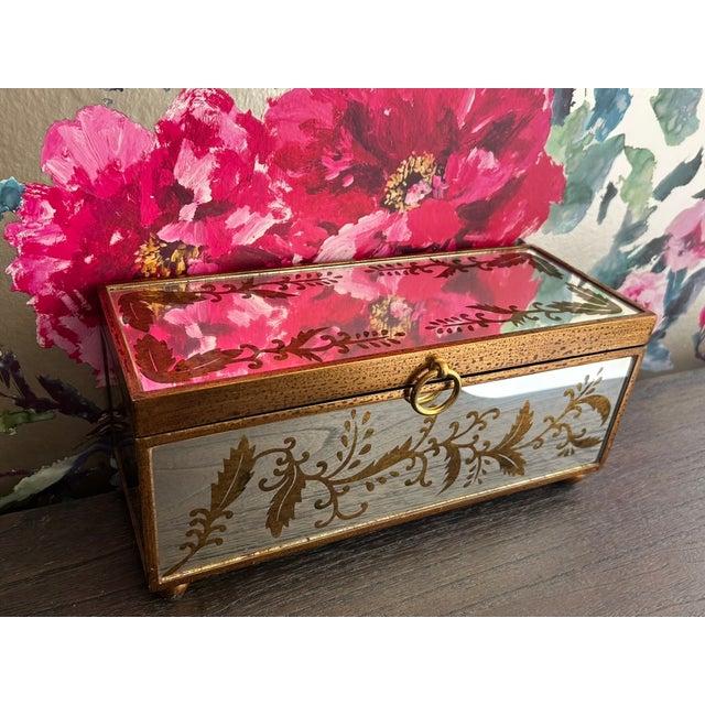 Mirrored with Intricate Hand Painted Gold Design on lid and box. By: Chelsea House