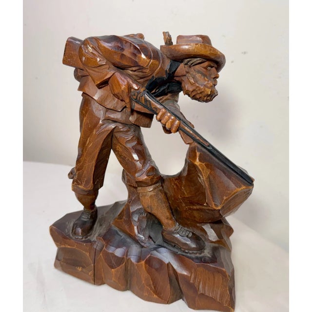 This antique hand carved wood Folk Art hunting sculpture is a unique and beautifully crafted piece of art. Made of a solid...