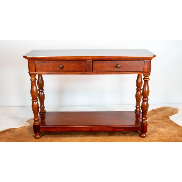 Ralph Lauren mahagony console table, circa 1990s. European design with lovely details, trim and hand turned legs....