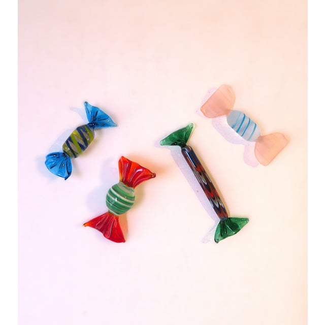 A beautiful and fun set of four (4) Italian Murano art glass candy pieces, sculptures, hand-made, in the Modern design...