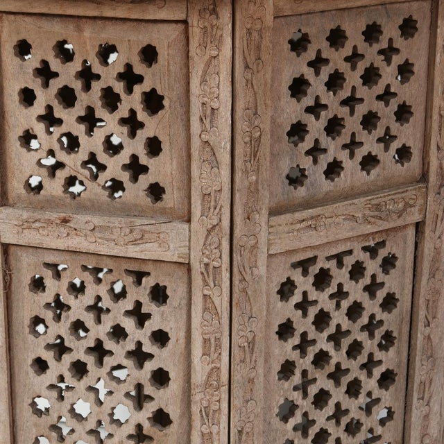 Beautifully hand-carved Moroccan accent table featuring intricate floral and geometric detailing throughout. The octagonal...