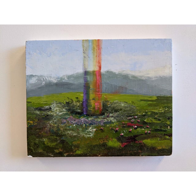 In "Rainbow Hole," vibrant colors burst forth from a central column, creating a striking contrast against the lush green...