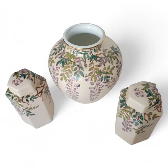 This exquisite set of three vintage Chinese style vase and cannisters hand painted and in the style of Andrea by Sadek is...