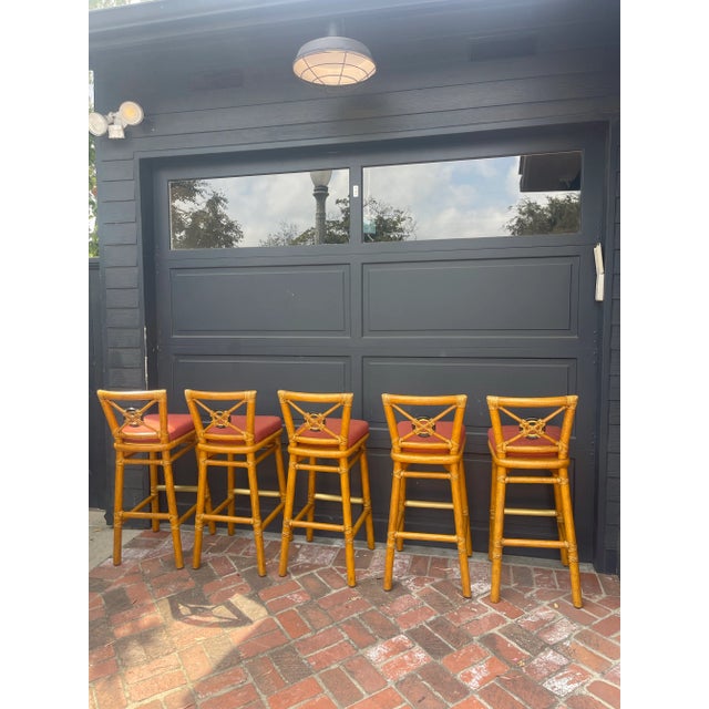 A classic set of five bar stools by McGuire, featuring their signature bamboo frames and refined leather rawhide lashing....