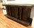 A fabulous vintage hand hammered credenza with plates riveted to a wood frame. There are 4 doors with 4 long handles. Each...