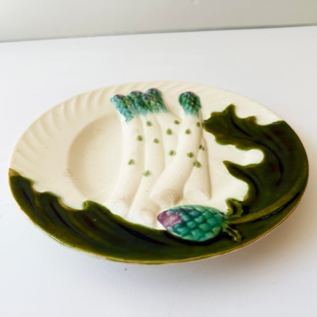 Beautiful antique French majolica asparagus plate by Salins-les-Bains, France, dating to circa 1890. Featuring raised...