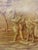 This is a painting in the style of grisaille which uses monochromatic tones of warm brown to simulate a bas-relief. Three...