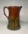 This vintage crackled glazed pitcher depicts two scenes; a pair of lovebirds, and a family of birds on the opposite side....