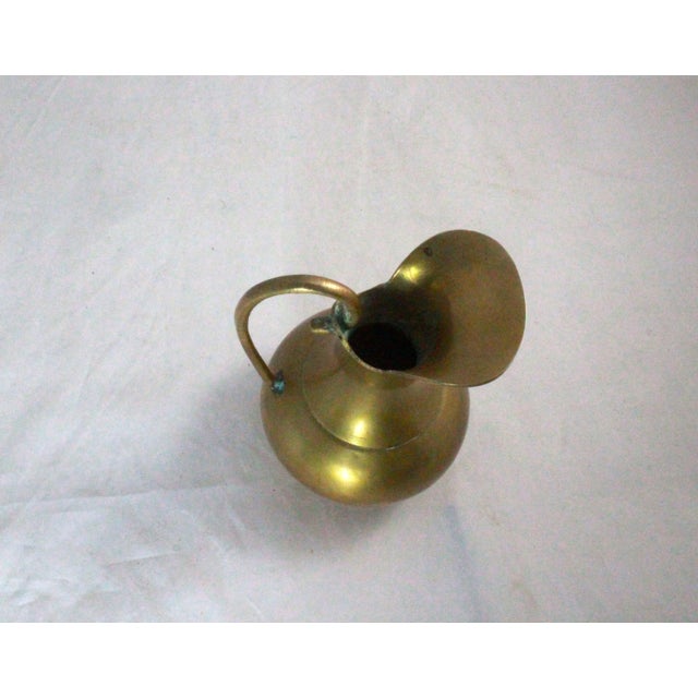 This is a Vintage Solid Brass Pitcher 5" TALL 3.5" WIDE