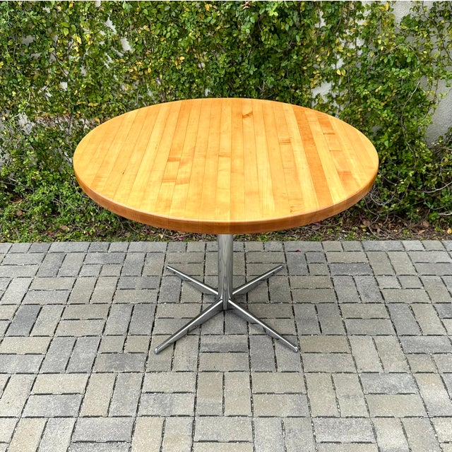 A fully refinished mid century modern butcher block x-base dinette table, sourced from a Boyd Georgi home in Pasadena. The...