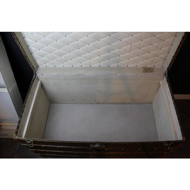 This superb Louis Vuitton travel trunk is distinguished by its hand-stenciled Monogram canvas, honey-colored "lozine"...